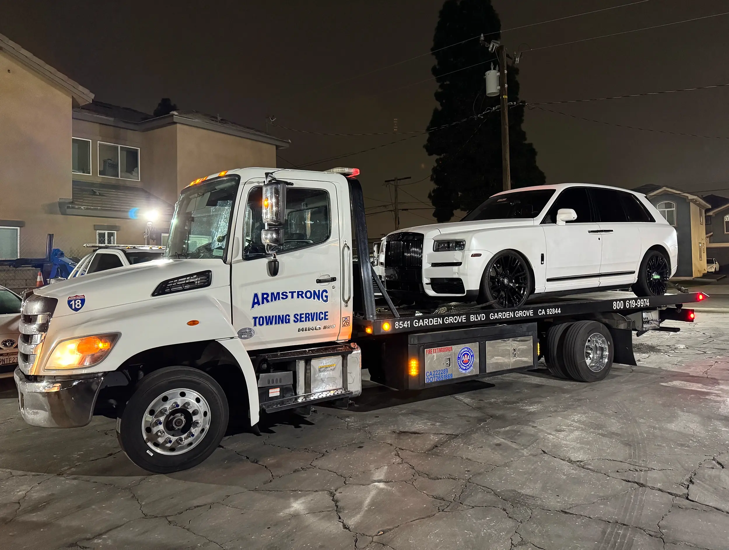 Stranded motorist receiving battery jump service