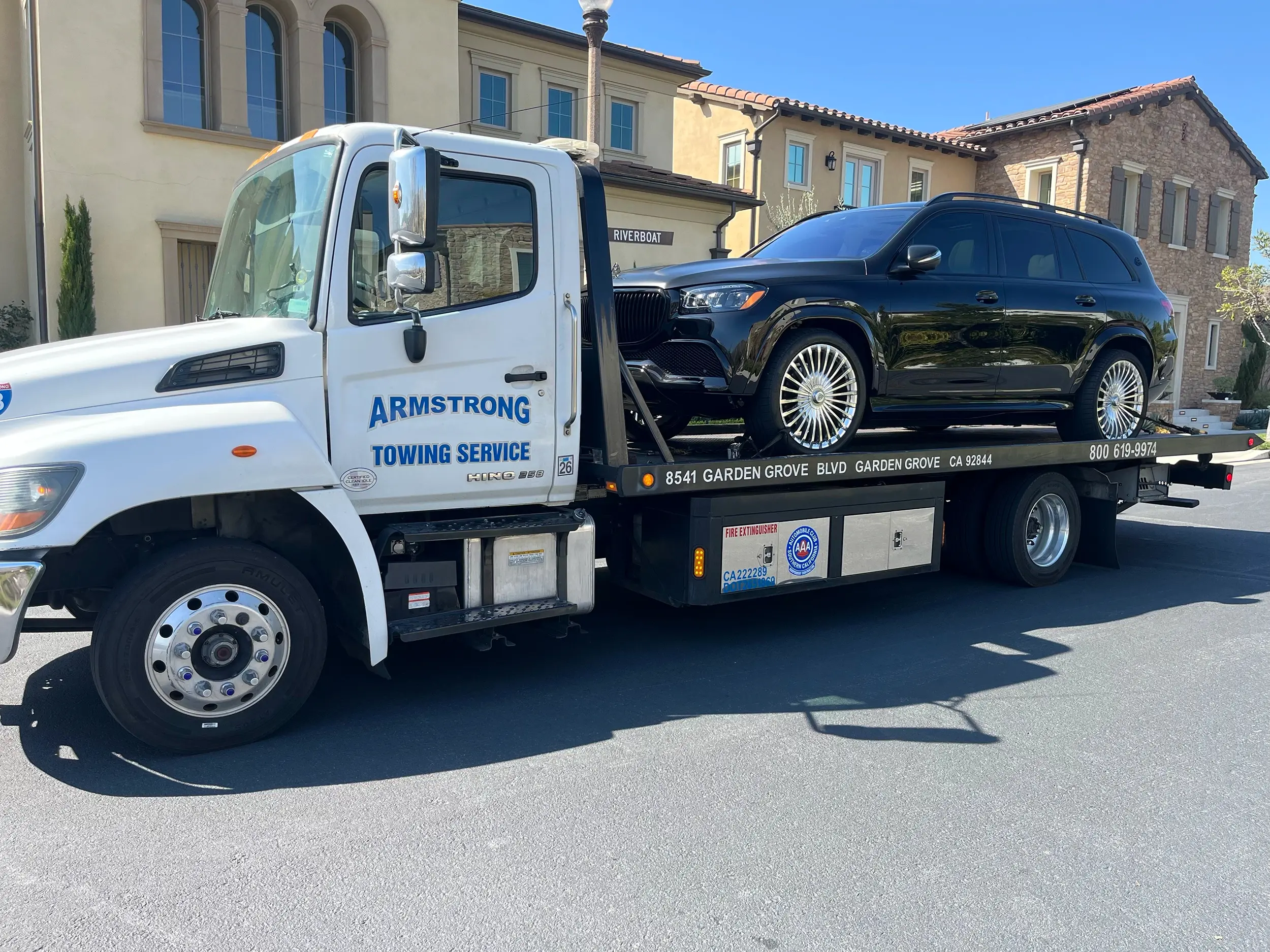 SUV receiving roadside assistance