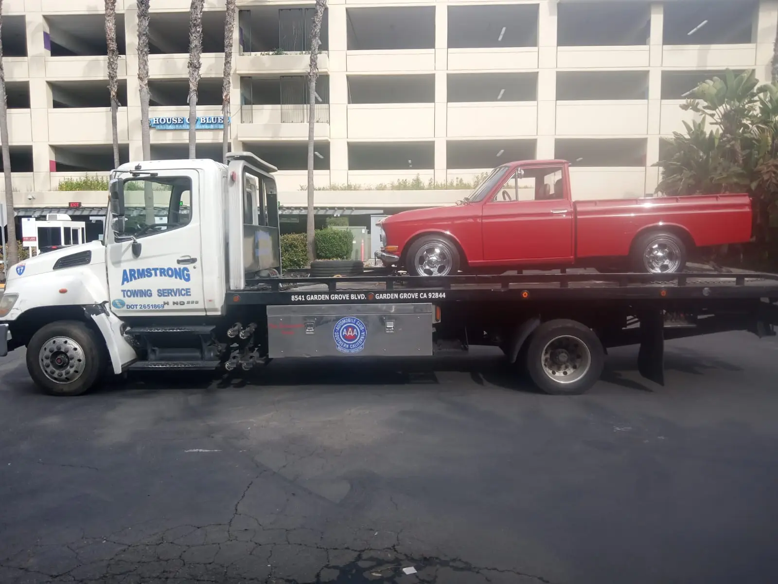 Classic car being delicately loaded for transport